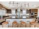 Well-appointed kitchen featuring a large island with seating, modern lighting, and stainless steel appliances at 11280 Granite Ridge Dr # 1035, Las Vegas, NV 89135