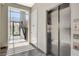 Bright lobby featuring elevator, staircase, and tiled floors at 11280 Granite Ridge Dr # 1035, Las Vegas, NV 89135