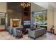 Relaxing lounge area with a fireplace, comfortable seating, and a view of the community pool at 11280 Granite Ridge Dr # 1035, Las Vegas, NV 89135
