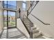 Modern staircase with sleek metal railings and a glass entrance door at 11280 Granite Ridge Dr # 1035, Las Vegas, NV 89135