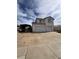 Two-story home with a three-car garage and an adjacent car port at 128 Appian Way, Henderson, NV 89002