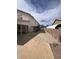 View of house showing yard, covered patio, and block wall at 128 Appian Way, Henderson, NV 89002