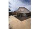 View of house showing yard, covered patio, and block wall at 128 Appian Way, Henderson, NV 89002