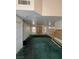 Spacious living area flowing into the kitchen; needs TLC at 128 Appian Way, Henderson, NV 89002