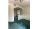Cozy living room with an archway and a window, creating an inviting space at 128 Appian Way, Henderson, NV 89002