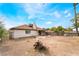 Wide shot of the backyard and rear of home with mature trees at 1356 Spague St, Henderson, NV 89011