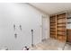 Unfinished basement with open storage shelving and utility hookups at 1356 Spague St, Henderson, NV 89011