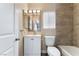Charming bathroom featuring a white vanity, custom tile, and a bathtub with shower at 1356 Spague St, Henderson, NV 89011
