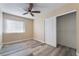 Bedroom with ceiling fan, window, and closet with sliding doors at 1356 Spague St, Henderson, NV 89011
