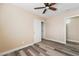 Neutral bedroom with hardwood floors, ceiling fan, closet, and updated trim at 1356 Spague St, Henderson, NV 89011
