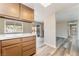 Bright, open floor plan showcasing the kitchen with updated cabinets and views into the backyard at 1356 Spague St, Henderson, NV 89011