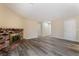Spacious living room with luxury vinyl floors and a charming brick fireplace feature at 1356 Spague St, Henderson, NV 89011