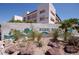 A view of Rebel Park Condominiums, showcasing landscaping and building exterior at 1381 E University Ave # 310, Las Vegas, NV 89119