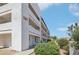 Apartment building featuring multiple balconies and well-maintained landscaping at 1381 E University Ave # 310, Las Vegas, NV 89119