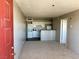 Inviting living room with neutral carpet and an eat-in kitchen with white appliances at 1381 E University Ave # 310, Las Vegas, NV 89119