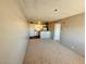 A well lit living room and kitchen area offers a seamless living experience at 1381 E University Ave # 310, Las Vegas, NV 89119