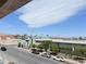 A bright street view showcasing the community with green doors and landscaping at 1381 E University Ave # 310, Las Vegas, NV 89119