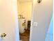 Water heater visible in a utility closet with modern laminate flooring at 1381 E University Ave # 310, Las Vegas, NV 89119