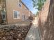 Backyard showcasing low-maintenance landscaping, patio area, and a block wall offering privacy at 1434 Summer Glow Ave, Henderson, NV 89012