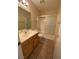 Bathroom featuring a shower-tub combo with sliding glass doors, single sink vanity, and tile flooring at 1434 Summer Glow Ave, Henderson, NV 89012