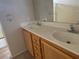 Bathroom featuring a double sink vanity, large mirror, and neutral finishes at 1434 Summer Glow Ave, Henderson, NV 89012