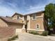 Charming two-story home with a two-car garage, tan stucco and tile roof at 1434 Summer Glow Ave, Henderson, NV 89012