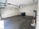 Spacious two car garage with concrete flooring and built in shelves at 1434 Summer Glow Ave, Henderson, NV 89012