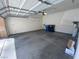 Spacious two-car garage interior with overhead lighting and ample room for parking and storage at 1434 Summer Glow Ave, Henderson, NV 89012