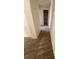 Hallway featuring neutral carpet leading to the bathroom and other rooms at 1434 Summer Glow Ave, Henderson, NV 89012