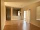 Open-concept living space with hardwood floors and modern lighting at 1434 Summer Glow Ave, Henderson, NV 89012