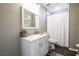 Bathroom featuring a white vanity with gray walls, a mirror, and a shower with a white curtain at 1521 Sombrero Dr, Las Vegas, NV 89169