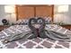Bedroom features hotel-style towel arrangement and bedside tables with lamps at 1521 Sombrero Dr, Las Vegas, NV 89169