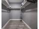 Walk-in closet featuring built-in shelves and wood-look floors at 1521 Sombrero Dr, Las Vegas, NV 89169