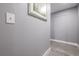 Hallway with wood floors, white trim, light-switch and silver framed print on the wall at 1521 Sombrero Dr, Las Vegas, NV 89169