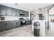 Modern kitchen with gray cabinets and stainless steel appliances with an open layout at 1521 Sombrero Dr, Las Vegas, NV 89169