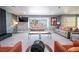 Spacious living room featuring modern gray walls, tile flooring, and large windows, creating an inviting space at 1521 Sombrero Dr, Las Vegas, NV 89169
