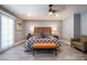 Bedroom featuring a bed, chair, and bedside tables with lamps and gray walls at 1521 Sombrero Dr, Las Vegas, NV 89169