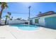 Backyard features sparkling inground pool with mature palms at 1521 Sombrero Dr, Las Vegas, NV 89169
