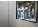 Shower niche tiled with decorative tile and stocked with Suave brand shampoo and conditioner bottles at 1521 Sombrero Dr, Las Vegas, NV 89169
