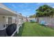 This backyard offers artificial turf, a covered patio, and space for relaxing and playing at 1622 Lorna Dr, Henderson, NV 89011