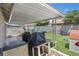 Backyard features an open covered patio and artificial turf at 1622 Lorna Dr, Henderson, NV 89011
