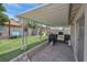 Beautiful covered patio and synthetic grass in a well-maintained backyard at 1622 Lorna Dr, Henderson, NV 89011