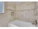 Elegant soaking tub featuring a modern tile accent and brushed nickel fixtures at 1622 Lorna Dr, Henderson, NV 89011