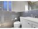 Bathroom features a modern vanity, toilet, and dark tile accents at 1622 Lorna Dr, Henderson, NV 89011