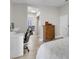 Bright bedroom with desk, wood dresser, and access to the ensuite bathroom at 1622 Lorna Dr, Henderson, NV 89011
