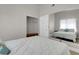 Bright bedroom featuring a large mirror and modern luxury vinyl plank flooring at 1622 Lorna Dr, Henderson, NV 89011