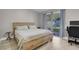 Bedroom with wood-look floors, sliding glass doors, and a wood bed frame at 1622 Lorna Dr, Henderson, NV 89011