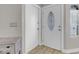 Bright entryway featuring a decorative glass door, light wood floors, and a coat closet at 1622 Lorna Dr, Henderson, NV 89011
