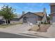 Single-story home featuring a stucco facade, arched windows, and a one-car garage at 1622 Lorna Dr, Henderson, NV 89011