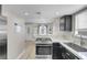 Open kitchen featuring stainless steel appliances and easy access to dining area at 1622 Lorna Dr, Henderson, NV 89011